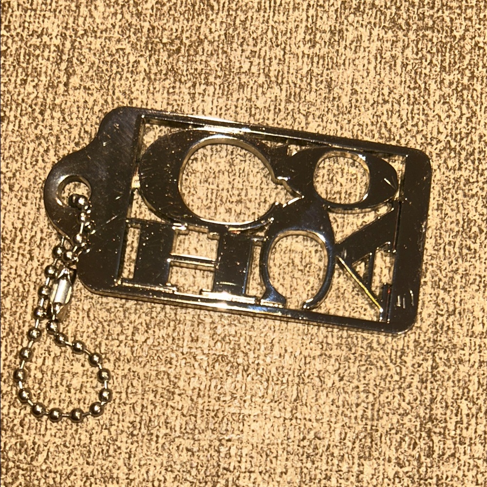 Coach 70th Anniversary Metal Hangtag Bag Charm Cutout - Silver Tone